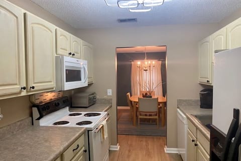 Remodeled kitchen with new microwave and backspash