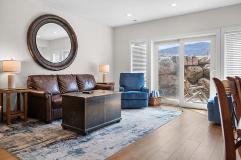Bright and inviting lower-level living space with comfortable seating and a private entrance.