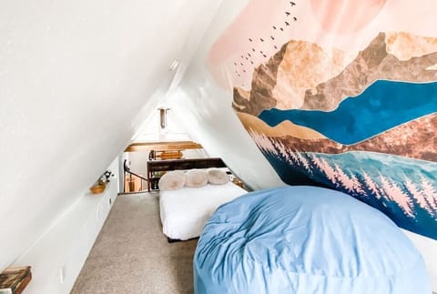 Just atop the spiral staircase, this ultra-adorable loft bedroom is sure to be one of your favorite spots! Enjoy a fabulous night’s sleep beneath a grand mountain backdrop, or crash on the massive sleep sack for the ultimate nap.