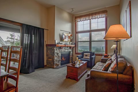Living room with gas fireplace and queen sleeper sofa