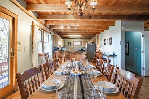 Dining table on main level seat 8 with bar settings for 6 additional people.