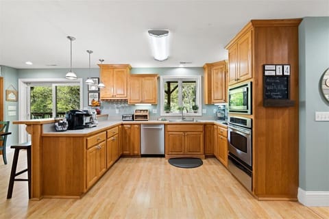 Double kitchen: coffee bar, oven, microwave, dishwasher, and ice maker.