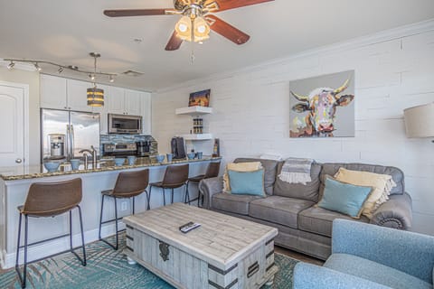 Queen size pullout sofa. Dining or workspace at the kitchen bar.
