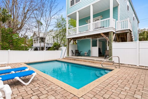 Your private pool awaits, surrounded by tropical palms and just steps from your covered patio.