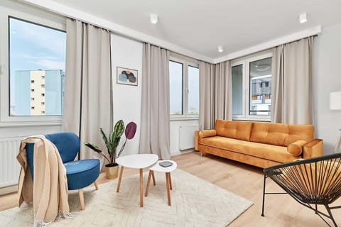 Living room with a comfortable sofa and TV. 