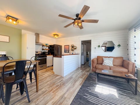 Modern updated apartment with open kitchen, living, dining and separate bedroom with attached bathroom. Unit includes laundry and is fully stocked to serve as your home base in the Black Hills!