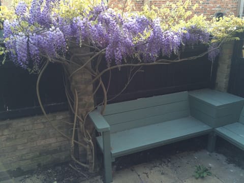 Back courtyard seating area with dovecote in the background