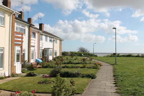 5 Sea View Walk (second garden along from the left with the wooden bench)