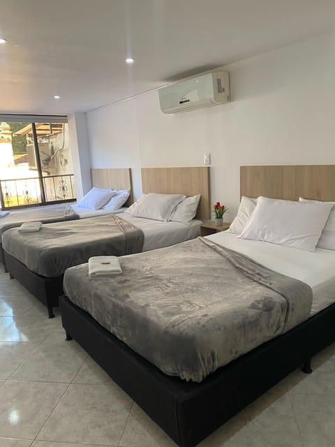 Family Room, Multiple Beds, Air conditioning | Premium bedding, desk, WiFi (free), bed sheets