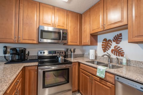 Fully equipped kitchen features a keurig and 12-cup coffee maker options.