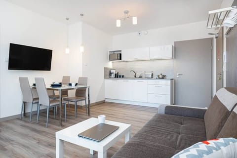 Living room of Pięć Mórz Lotnicza 1I/20 apartment with sofa