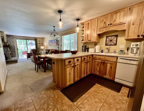 Entry view kitchen and living room