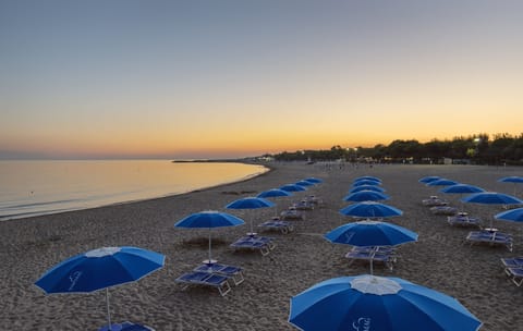 On the beach, free beach cabanas, beach umbrellas, beach towels