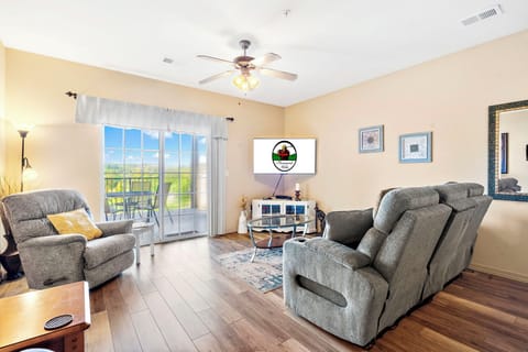 Living Room with new flooring and new reclining furniture, cable TV, Patio Access