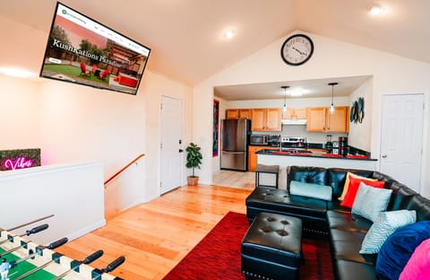 Entertainment meets culinary delights! Our living room and kitchen combo offers the perfect blend of relaxation and fun. From TV time to foosball battles, every moment is a celebration of good times. 🛋️🍽️ #HomeSweetHome #LivingRoomFun