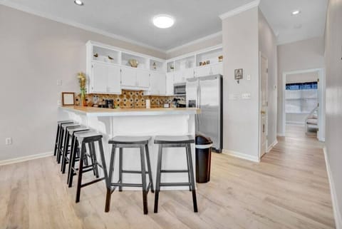 Fully equipped kitchen with bar seating—perfect for snacks, chats, and easy meals.