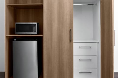 Premium bedding, desk, laptop workspace, blackout drapes