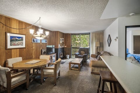 Cozy Living Room with a Flat Screen TV and Wood Burning Stove