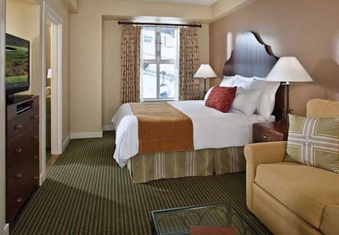 Sample master with king bed and pull out sofa. Decor may vary. 