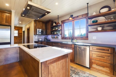 Fully equipped kitchen with a table with booth seating