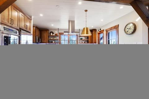 Fully equipped kitchen with a table with booth seating