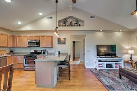 Living/dining rooms, 13' ceiling, large fan. It's open and airy yet super cozy.