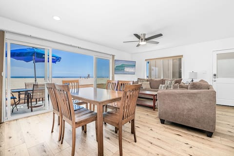 Sliding doors open from the living area to the front patio and beachfront. Vacation is served!
                