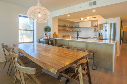 You can seat up to 8 people at the dining table and 4 people on the kitchen stools.
