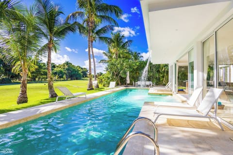 Private pool surrounded by tropical greenery.