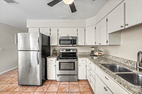 Whip up breakfast or pour wine at the dry bar—this layout was made for connection.