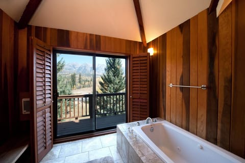 Master bathroom with tub and deck access