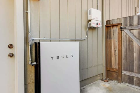 Modern smart-home feature: Tesla Powerwall installed for seamless backup energy and increased reliability.