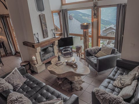 Lounge area with double height windows.