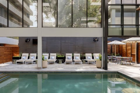 Indoor pool, open 7:00 AM to 10:00 PM, pool umbrellas, sun loungers