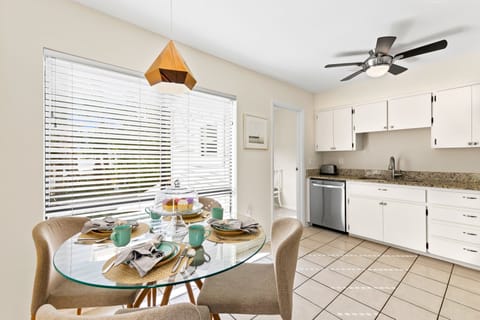 Gather around the table where casual bites and lively conversation blend seamlessly.