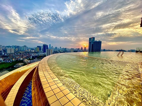 Outdoor pool, open 6:00 AM to 10:00 PM, pool umbrellas, sun loungers