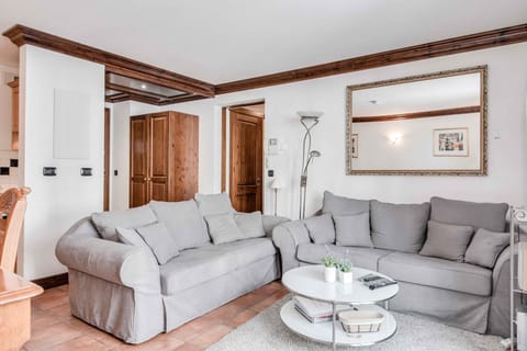 Living room has 2 sofas including a double sofa bed