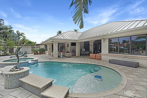 Sailfish Water Villa fountain & waterfall,  Hot Tub, Fire & Boho lounging areas 