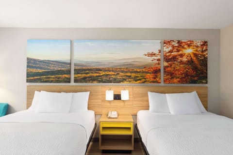 Room, 2 Queen Beds, Non Smoking | Blackout drapes, iron/ironing board, cribs/infant beds, free WiFi