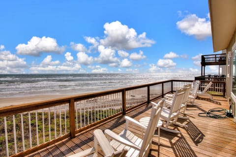 Settle into these cozy deck chairs and soak up panoramic ocean views stretching to the horizon from your private beachfront balcony.