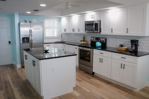 Bright, updated kitchen with soft close cabinets and drawers