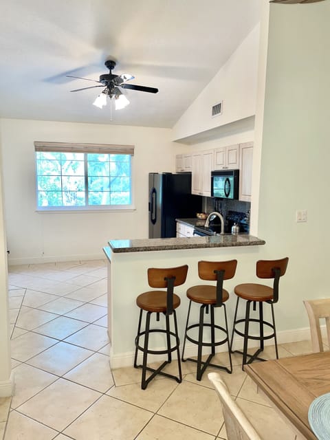 Spacious kitchen with bartop seating