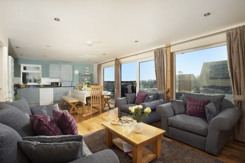 Open plan living area, sofa's, dining table and countryside view - Lodge 40, Retallack