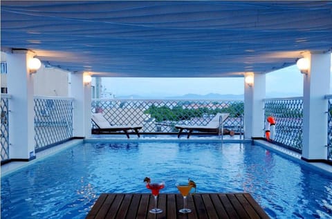 Indoor pool, pool umbrellas, sun loungers