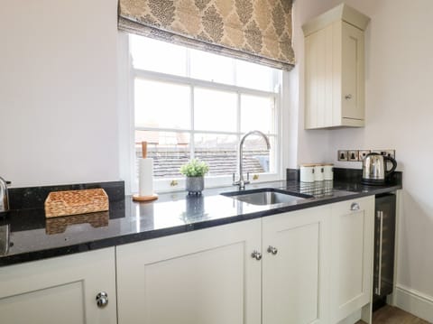 Fridge, electric kettle, toaster, cookware/dishes/utensils