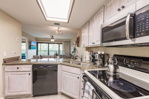Open floor plan, Kitchen lookin g out onto dining & living area.