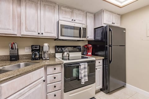 The fully equipped kitchen has everything you need to prepare your meals or order in.