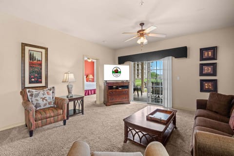 Living Room with Cable, Flat Screen TV, and Deck Access