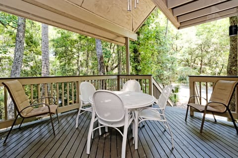 The covered deck offers a peaceful outdoor living space