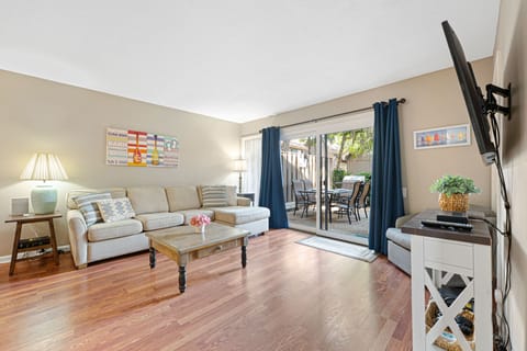 Large glass doors open to a private balcony, bringing in natural light and extending the living space outdoors.